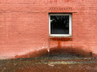 Wall Mural - water leaking from window damaged alley brick building