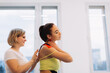 © dsheremeta - Physical therapist placing kinesio tape on woman patient's shoulder and neck