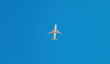 Bottom View Of Passenger Airplane Flying Overhead