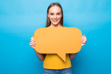 Young woman holding a speech bubble isolated on blue background