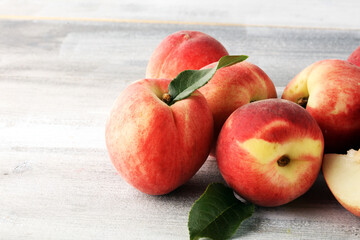 Wall Mural - A group of ripe peaches on wooden table