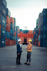 Wall Mural - Executives and chief engineers are currently inspecting work in the international shipping depots, container yard, Concepts of importing and exporting lndustrial business