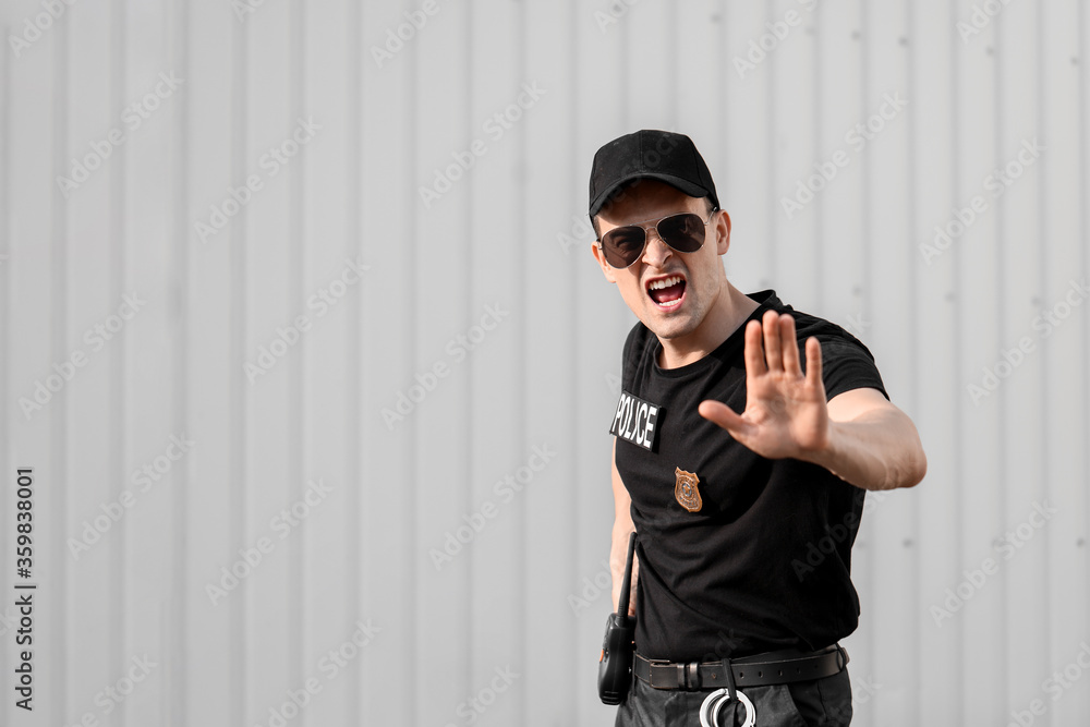Aggressive police officer in the street