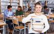 © JackF - Female student sitting in library