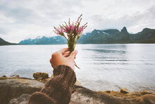Hand Holding Flowers Bouquet Foggy Mountains Landscape Travel Lifestyle Vacations Outdoor Woman Walking Alone In Norway