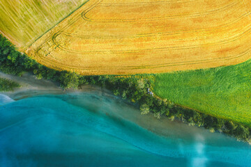 Wall Mural - Aerial view above rural fields and Rauma river landscape in Norway top down scenery Romsdalen valley agriculture countryside