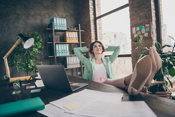 Wall Mural - Profile photo of beautiful business lady hold hands behind head look up dreamy imagination flight minded resting remote distance work legs on table sit big chair office indoors