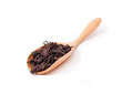 Famous chinese oolong tea da hong pao in the bamboo scoop isolated on a white background.