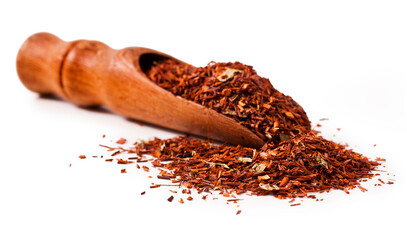 Wall Mural - Rooibos tea in a wooden scoop isolated on a white background.