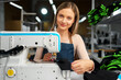© fotofabrika - Seamstress woman at her workplace sewing clothes on sewing machine