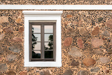 Old Window And Rocky Wall