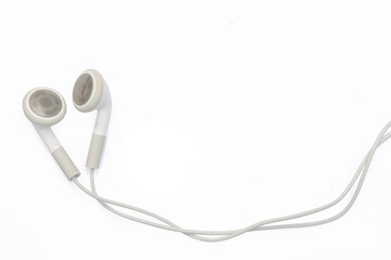 Wall Mural - white earphones isolated on white background with clipping path, copy space.