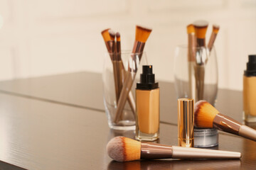 Poster - Decorative cosmetics and tools on dressing table in makeup room