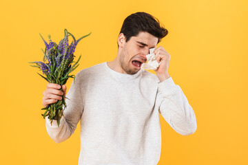 Poster - Photo of unhappy man with allergy crying while posing with flowers