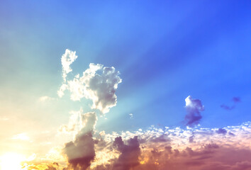 Wall Mural - sky and clouds nature background,bright sunset with yellow and orange light in blue sky