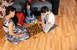 © Timur - Sweet family moments during lockdown, mother and her children playing chess