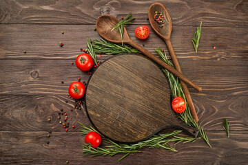 Canvas Print - Red tomatoes, wooden spoons and cutting board