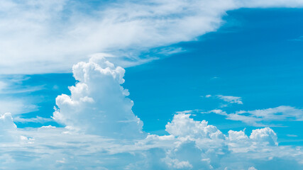 fluffy clouds in the clear sky