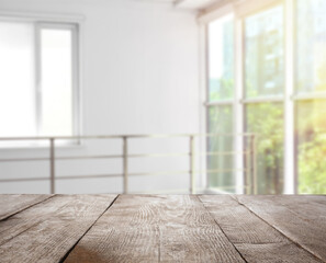 Wall Mural - Empty wooden surface and blurred view of modern window