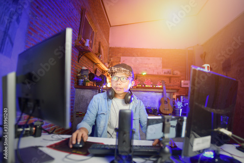 Fotomural Vlogger editing video create content for upload on social media or internet online connect communication people ware