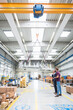 © Westend61 - Two men with indoor crane in a factory