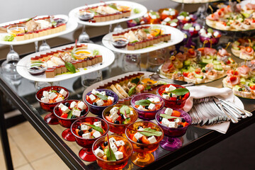 A group of people sitting at a table with a plate of food