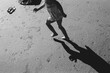 © Maria Manco/Stocksy - shadow of child running on beach