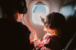 © Maria Manco/Stocksy - young girl traveling on a plane