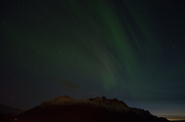 aurora borealis over autumn mountain