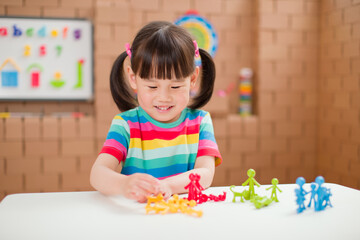 Wall Mural - toddler girl learning counting and math for homeschooling