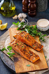 Wall Mural - Cedar plank grilled or roasted salmon with herbs, garlic and spices