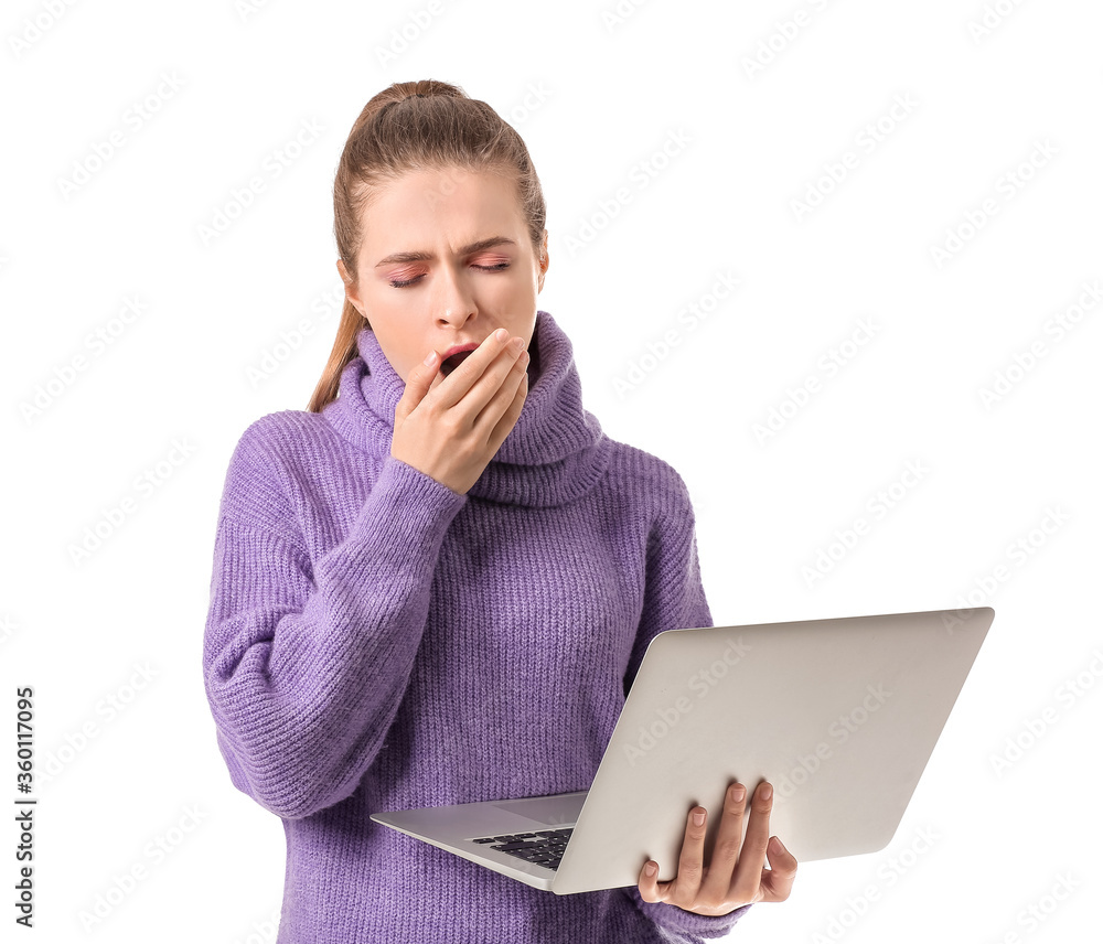 Tired woman with laptop on white background. Concept of sleep deprivation