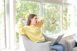 © Pixel-Shot - Young woman suffering from sleep deprivation with laptop at home