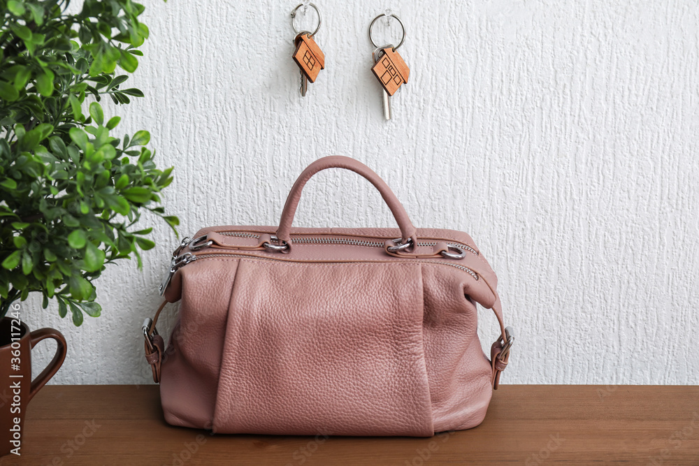 Keys from house hanging on wall in room