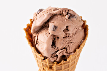 Wall Mural - Chocolate ice cream with chocolate pieces in a waffle cone