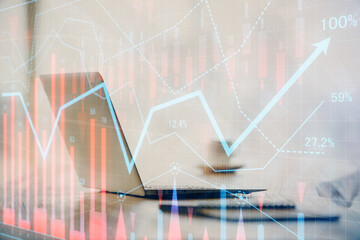 Multi exposure of graph and financial info and work space with computer background. Concept of international online trading.