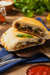 Wall Mural - Italian calzone with mushrooms and ham.