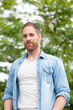 © Gelpi - Casual guy with a denim shirt in a park