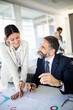 © NDABCREATIVITY - Collaboration and analysis by business people working in office
