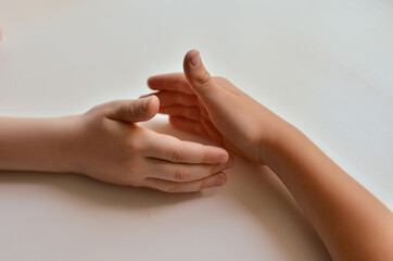 Wall Mural - child handshake, union, friendship.
