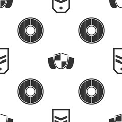 Poster - set chevron, shield and round wooden shield on seamless pattern. vector.