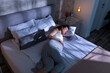 © Impact Photography - Pregnant woman lying in bed and sleeping at night