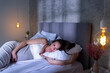 © Impact Photography - Pregnant woman lying in bed at night
