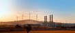 Industrial concept - Silhouette of Natural gas processing plant with Renewable energy wind turbines generating electricity