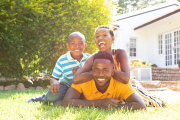 African American family spending time together in their garden. 