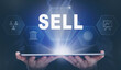 © Duncan Andison - Businessman holding a computer tablet display projecting a Sell concept.
