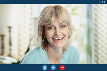 Video call screen of happy elderly female