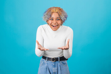 Wall Mural - excited smiling girl isolated on color background