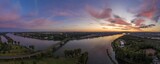 Fototapeta Niebo - Panoramic aerial picture of Mainspitze area with Main river mouth and city of Mainz during sunset