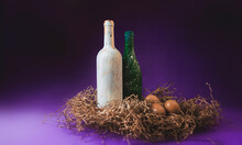 Bottles And Eggs On Purple Background